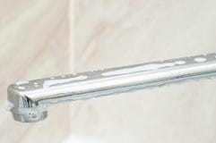 A Shiny Chrome Bathroom Faucet Is Soaped With A Detergent Solution