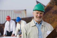 Shipping inspection engineers with plans royalty free stock image Shipping inspection engineers with plans royalty free stock image