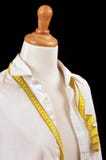 Dressmaker`s shirt and meter on a sewing mannequin stock photography Dressmaker`s shirt and meter on a sewing mannequin stock photography