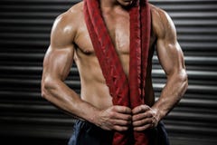 Shirtless man with battle rope around neck royalty free stock image Shirtless man with battle rope around neck royalty free stock image