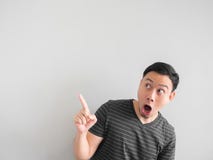 Shocked and surprised face of Asian man point on empty space. royalty free stock photography Shocked and surprised face of Asian man point on empty space. royalty free stock photography