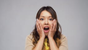 Shocked asian woman with open mouth