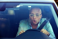 Shocked man driving car having accident stock images Shocked man driving car having accident stock images