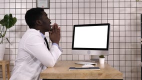 Shocked medical doctor looking on the screen of computer. White Display. royalty free stock image Shocked medical doctor looking on the screen of computer. White Display. royalty free stock image