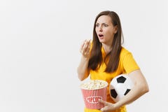 Shocked sad European woman, football fan holding soccer ball, bucket of popcorn upset of loss or goal of favorite team stock images Shocked sad European woman, football fan holding soccer ball, bucket of popcorn upset of loss or goal of favorite team stock images