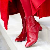 Shoes woman. beautiful boots on women`s legs. red shoes close-up outdoors. happy woman Royalty Free Stock Photo Shoes woman. beautiful boots on women`s legs. red shoes close-up outdoors. happy woman Royalty Free Stock Photo