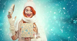 Shopping woman holding gift box on winter background with snow in black friday, Christmas and New Year holidays. Sale stock images Shopping woman holding gift box on winter background with snow in black friday, Christmas and New Year holidays. Sale stock images