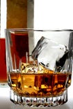 Shot Of Whiskey And Bottle Stock Photo