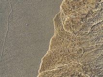 Shot of waves on sand stock photography Shot of waves on sand stock photography