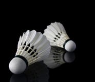 Shuttlecocks against black on reflective surface royalty free stock images Shuttlecocks against black on reflective surface royalty free stock images