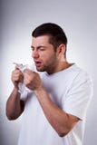 Sick man sneezing in wipe Stock Photo Sick man sneezing in wipe Stock Photo