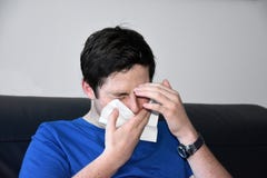 Sick teenage boy blowing his nose royalty free stock photography Sick teenage boy blowing his nose royalty free stock photography