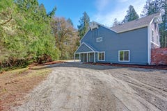 Large grey home exterior, side view. stock images Large grey home exterior, side view. stock images