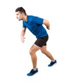Side view full length of determined caucasian man runner standing in running position looking ahead confident. Young guy sprinter stock photo Side view full length of determined caucasian man runner standing in running position looking ahead confident. Young guy sprinter stock photo