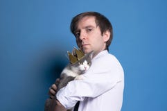 Side view of handsome serious man with grey cat stock image Side view of handsome serious man with grey cat stock image