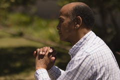 Side view of senior man hands leaning on a cane while sitting on bench royalty free stock photo Side view of senior man hands leaning on a cane while sitting on bench royalty free stock photo