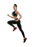 Sideview of smiling woman jumping on white background. stock photos Sideview of smiling woman jumping on white background. stock photos