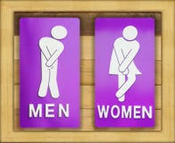 Signs female and male bathroom on wooden background. royalty free stock image Signs female and male bathroom on wooden background. royalty free stock image