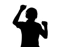 Silhouet van tiener het luisteren aan muziek in hoofdtelefoons en danc stock foto Silhouet van tiener het luisteren aan muziek in hoofdtelefoons en danc stock foto