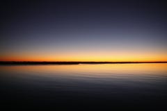 Silhouette of Calm Sea Under Blue and Orange Clear Sky during Sunset Royalty Free Stock Photo Silhouette of Calm Sea Under Blue and Orange Clear Sky during Sunset Royalty Free Stock Photo