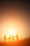 Silhouette Children playing on summer sunset happy time Royalty Free Stock Image Silhouette Children playing on summer sunset happy time Royalty Free Stock Image