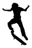 Silhouette With Clipping Path of Teen Boy On Skateboard Jumping