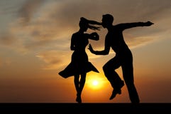 Silhouette Couple In The Active Ballroom Dance On Sunset Stock Photos