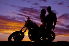 Silhouette Couple Look At Each Other On Motorcycle Stock Photography