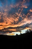 The silhouette of the dark hills under sunset sky stock photos The silhouette of the dark hills under sunset sky stock photos