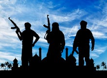 Silhouette de trois terroristes image stock Silhouette de trois terroristes image stock