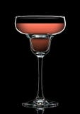 Silhouette de verre coloré de margarita sur le noir Images stock