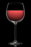 Silhouette de verre de vin coloré sur le noir Photos libres de droits