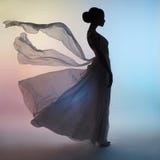 Silhouette elegant woman in blowing dress royalty free stock image Silhouette elegant woman in blowing dress royalty free stock image