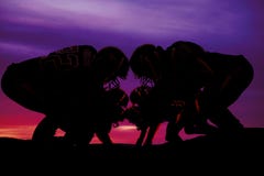 Silhouette of football players on the line royalty free stock images Silhouette of football players on the line royalty free stock images