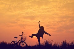 Silhouette of girl with bicycle on grass field Royalty Free Stock Photo Silhouette of girl with bicycle on grass field Royalty Free Stock Photo