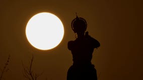 Silhouette girl oriental dancer a dance on sunset stock video footage Silhouette girl oriental dancer a dance on sunset stock video footage