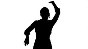 Silhouette Girl in square shirt and jeans shorts, sneakers, dancing. stock footage Silhouette Girl in square shirt and jeans shorts, sneakers, dancing. stock footage
