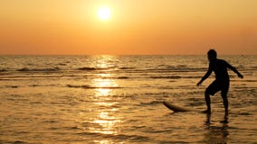 Silhouette of happy surf man surfing with long surf boards at sunset on tropical beach royalty free stock photos Silhouette of happy surf man surfing with long surf boards at sunset on tropical beach royalty free stock photos