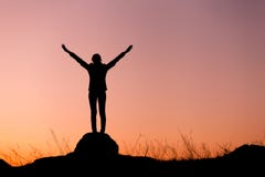 Silhouette of happy young woman against beautiful colorful sky. Stock Image Silhouette of happy young woman against beautiful colorful sky. Stock Image