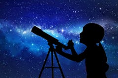 Silhouette of little girl looking through a telescope