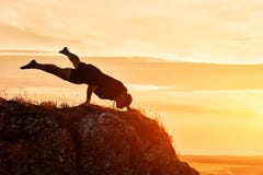 Silhouette of man doing yoga meditation against beautiful sky with clouds. Royalty Free Stock Photo Silhouette of man doing yoga meditation against beautiful sky with clouds. Royalty Free Stock Photo