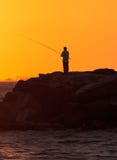 Silhouette of Man fishing stock images Silhouette of Man fishing stock images