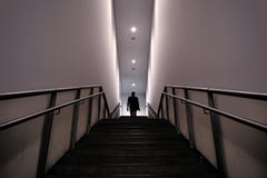 Silhouette of a man in mysterious stairs