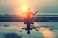 Silhouette meditation girl on the background of the stunning sea and sunset. stock images Silhouette meditation girl on the background of the stunning sea and sunset. stock images