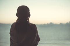Silhouette of naked woman with wet hair wrapped in a blanket after swimming. royalty free stock photo Silhouette of naked woman with wet hair wrapped in a blanket after swimming. royalty free stock photo