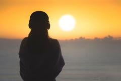 Silhouette of naked woman with wet hair wrapped in a blanket after swimming. royalty free stock photos Silhouette of naked woman with wet hair wrapped in a blanket after swimming. royalty free stock photos