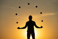 Silhouette Of A Man Juggling With Balls At Sunset Stock Image Silhouette Of A Man Juggling With Balls At Sunset Stock Image