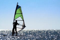 Silhouette Of A Woman Windsurfer Stock Photography