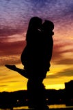 Silhouette Of A Young Couple By The Water Royalty Free Stock Photography