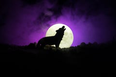 Silhouette Of Howling Wolf Against Dark Toned Foggy Background And Full Moon Or Wolf In Silhouette Howling To The Full Moon. Hallo Stock Photography